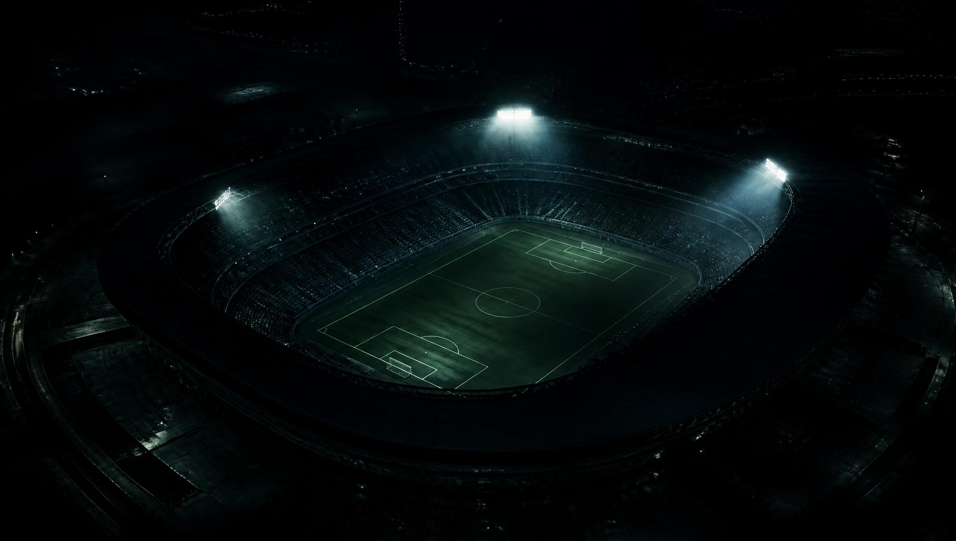Floodlit stadium at night